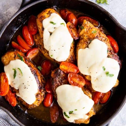 cast iron skillet with balsamic glazed caprese chicken