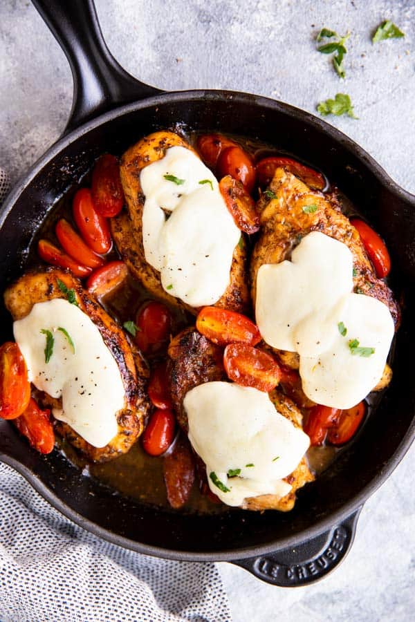 cast iron skillet with balsamic glazed caprese chicken