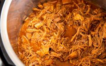 instant pot with honey bbq pulled pork inside
