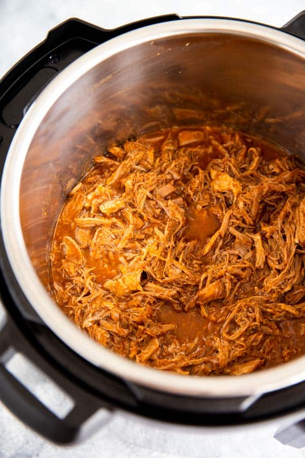 instant pot with honey bbq pulled pork inside