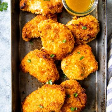 dark baking pan with coconut chicken