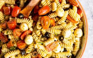 large bowl with pesto pasta salad