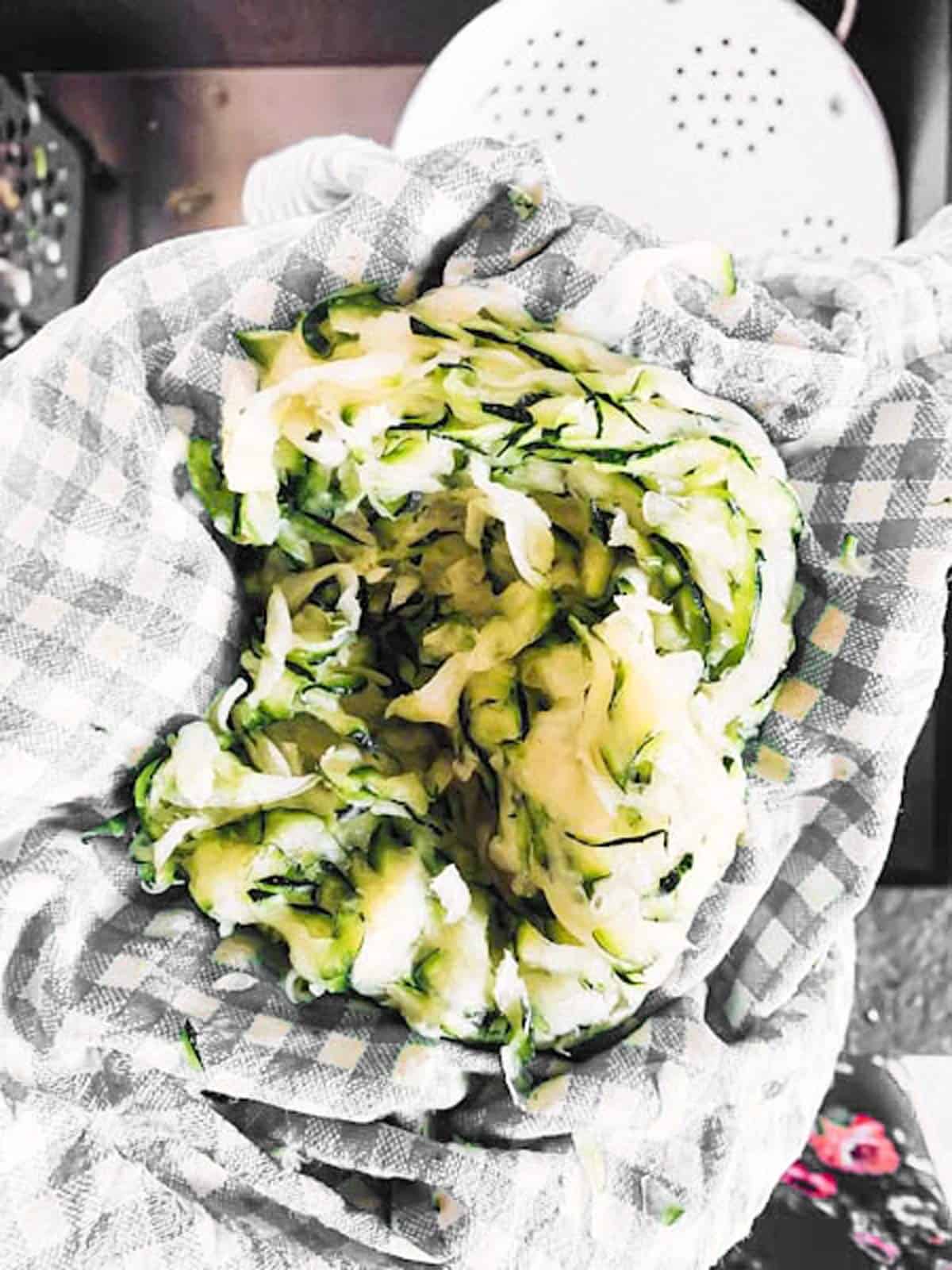 shredded zucchini in tea towel