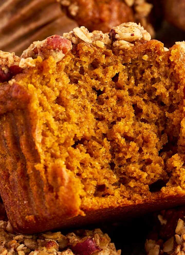 Halved healthy pumpkin muffin in a close up photo.