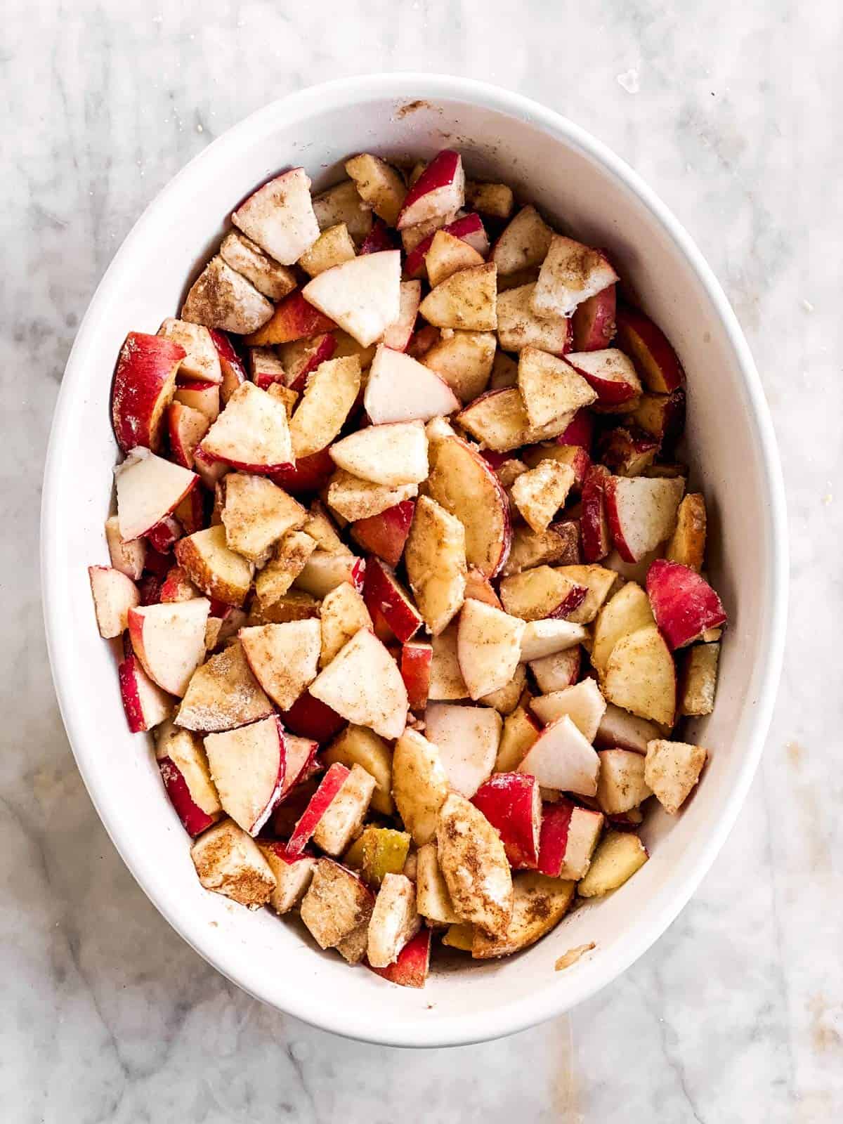 apple crisp filling in white baking dish