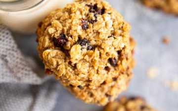 healthy oatmeal breakfast cookies on a table with a glass of milk