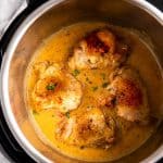 instant pot with chicken thighs in creamy sauce