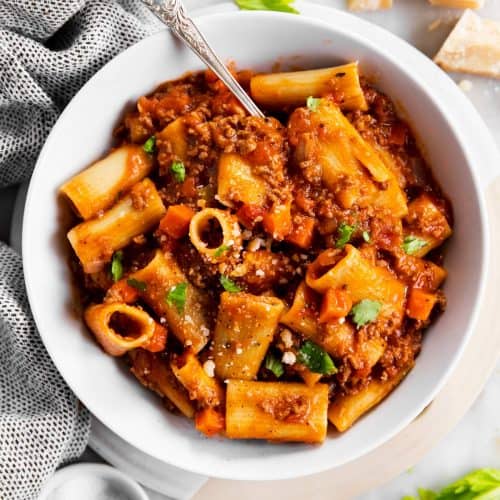 white bowl with rigatoni bolognese