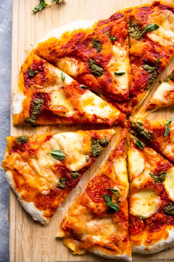 sliced pizza on a wooden board