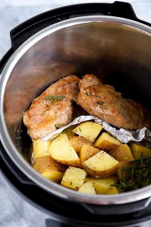 pork chops and potatoes inside an instant pot