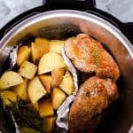 top down view of an instant pot filled with pork chops and potatoes