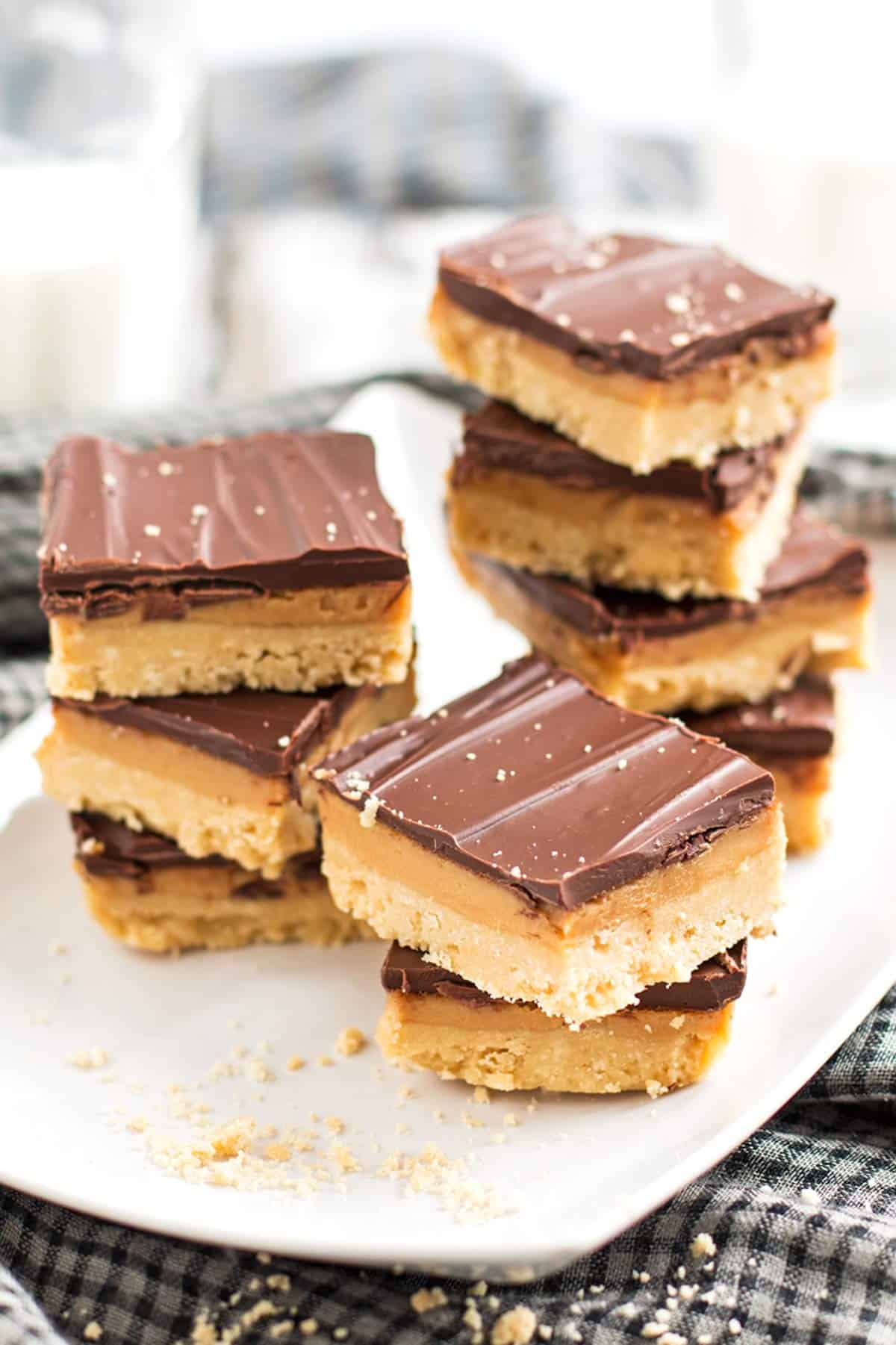 three stacks of millionaire's shortbread on white platter