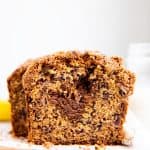 slice of banana bread with cinnamon filling on a wooden board