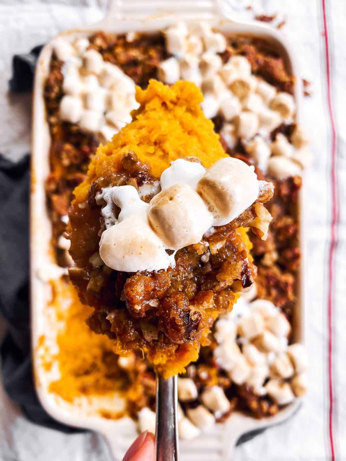 spoon with sweet potato casserole