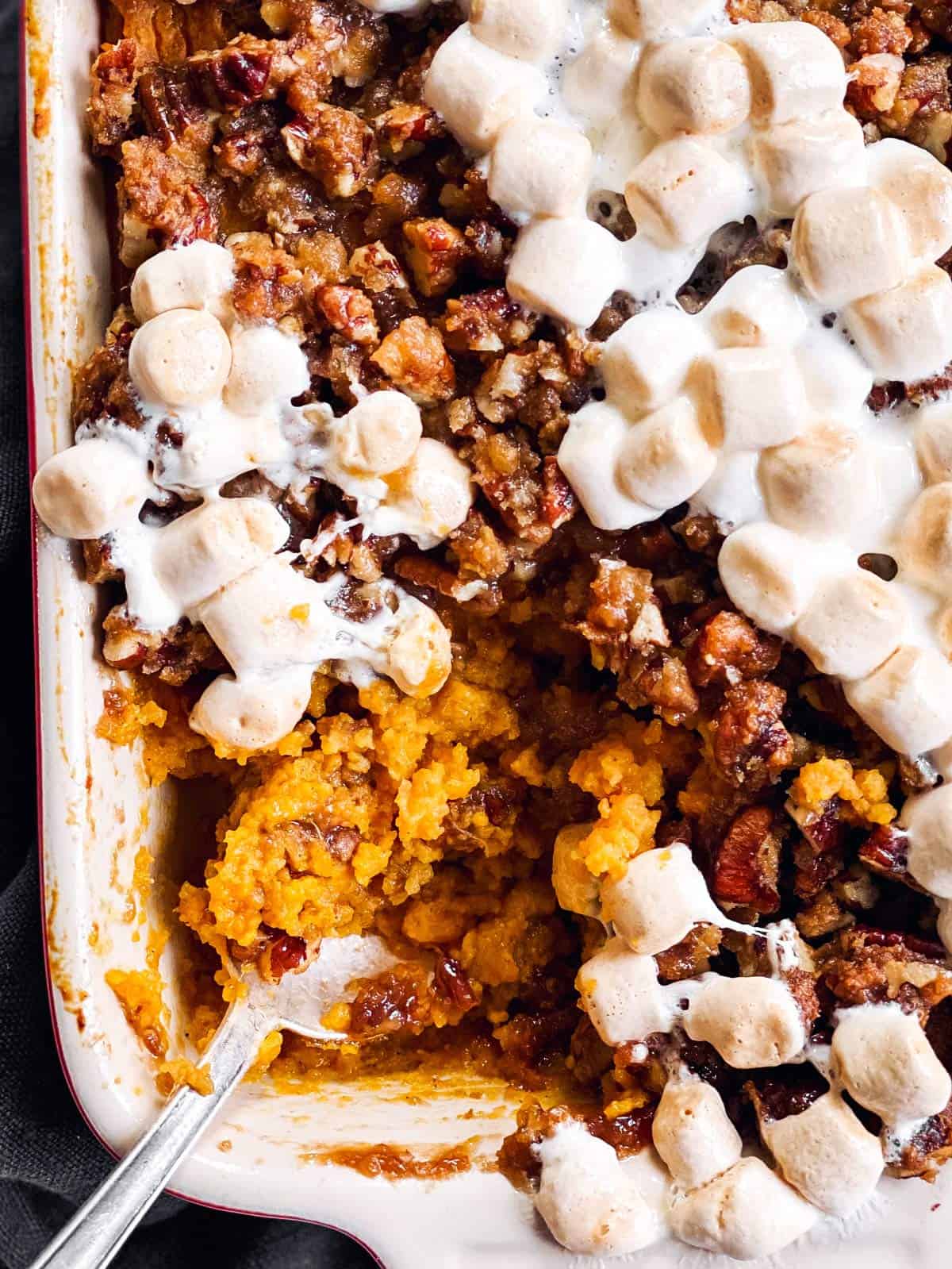 close up photo of spoon in sweet potato casserole