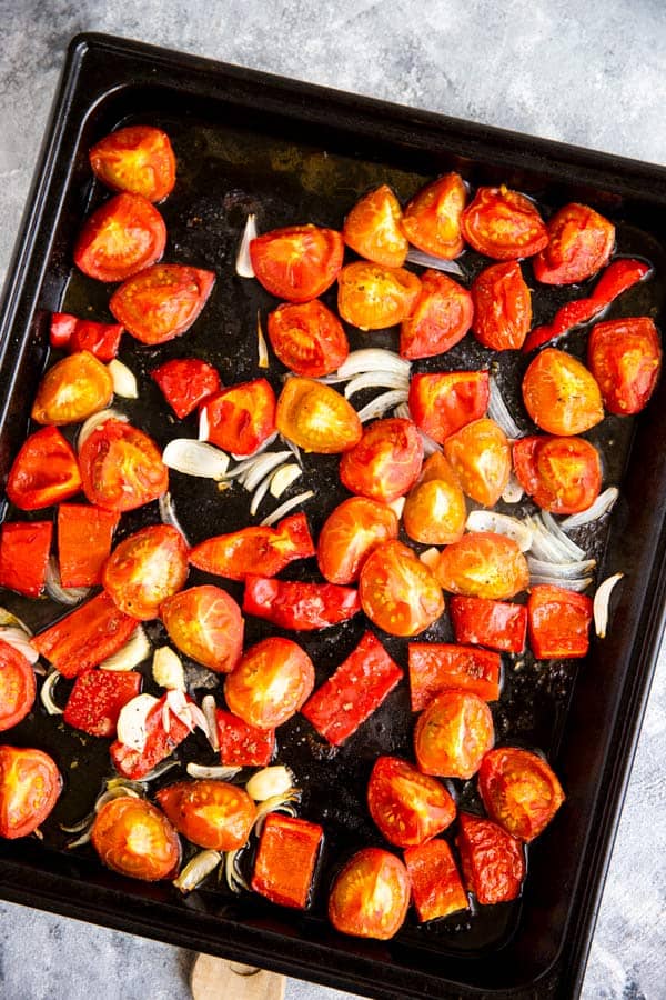sheet pan with roasted tomatoes for a fresh tomato soup