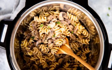 top down view of an instant pot filled with noodled and stroganoff