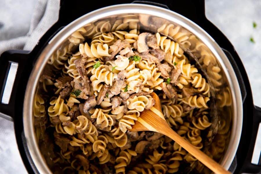 top down view of an instant pot filled with noodled and stroganoff