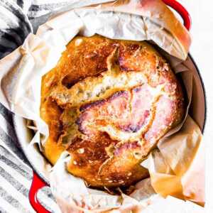 baked bread in red Dutch oven