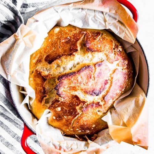 baked bread in red Dutch oven