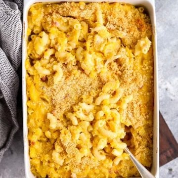 white baking dish with butternut squash mac and cheese