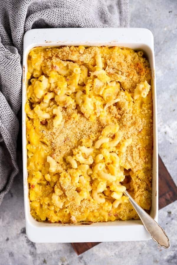 white baking dish with butternut squash mac and cheese