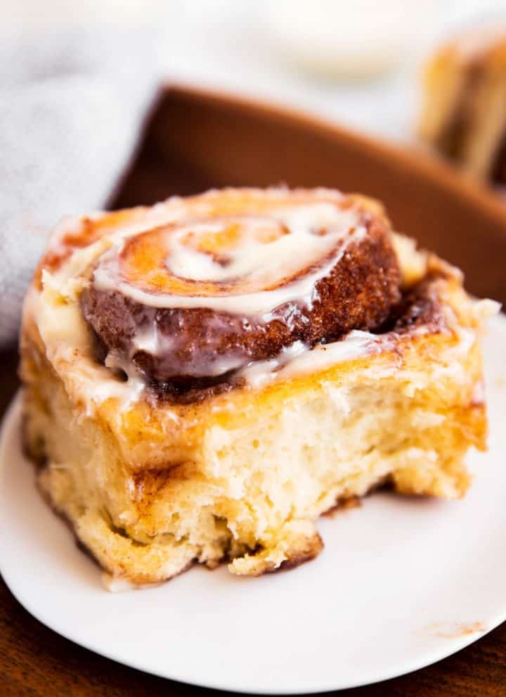 cinnamon roll sitting on white plate