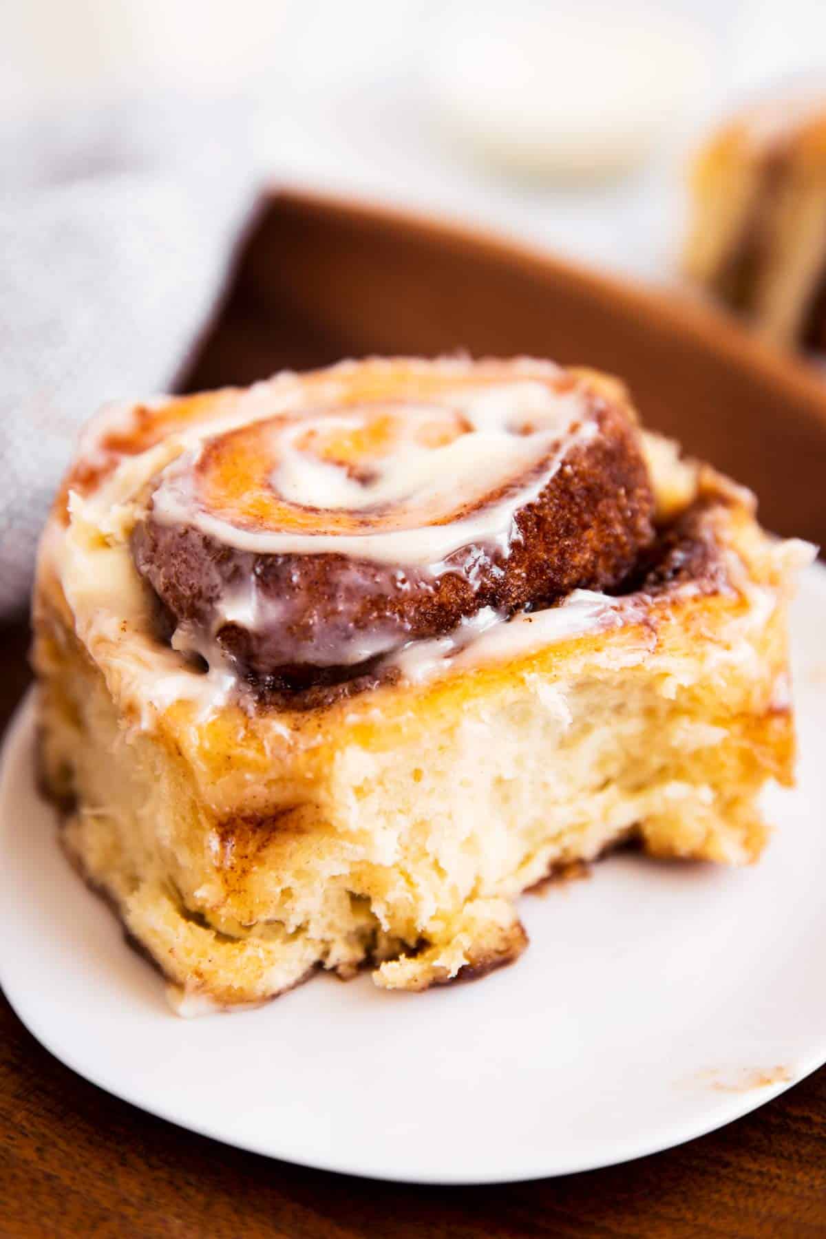 cinnamon roll sitting on white plate