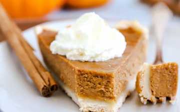 close up photo of a slice of pumpkin pie