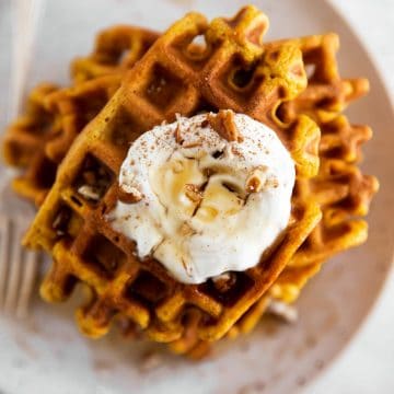 close up of pumpkin waffle stack on plate