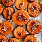 sheet pan with sliced roasted sweet potatoes