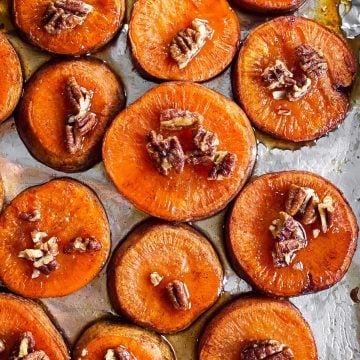 sheet pan with sliced roasted sweet potatoes