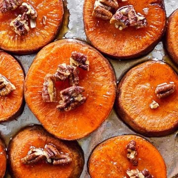 sheet pan with sliced roasted sweet potatoes