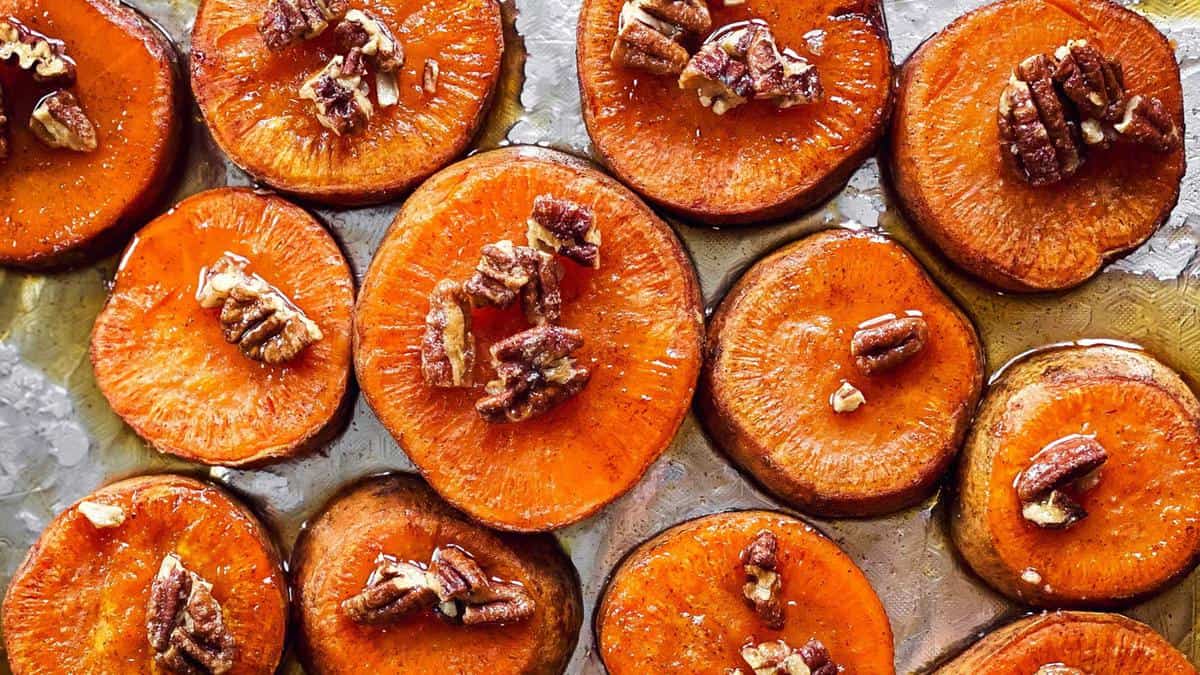 sheet pan with sliced roasted sweet potatoes