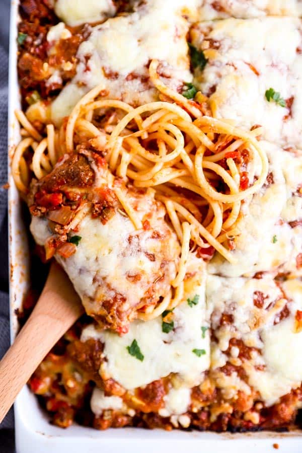 close up photo of a scoop of spaghetti casserole in the dish