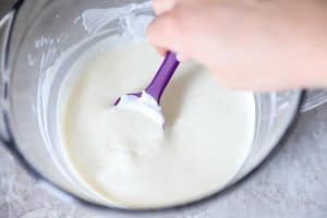 cheese sauce for spaghetti pie in a glass mixing bowl