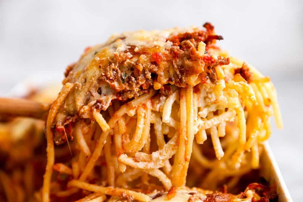 slice of spaghetti bake scooped out of casserole dish