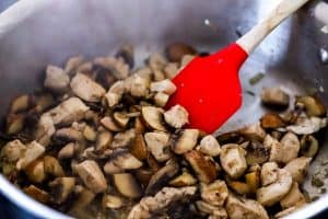 cooking mushrooms and chicken for a casserole