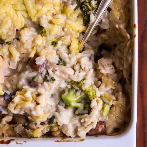 close up photo of a stirred up chicken broccoli rice casserole