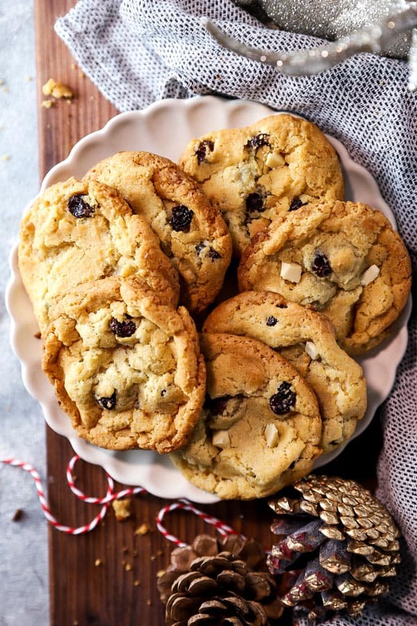 cookie plate on a wooden board with christmas decor around