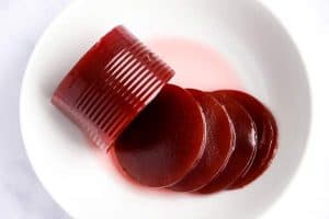 sliced jellied cranberry sauce on a white plate