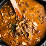 overhead view of cast iron skillet with mushroom gravy