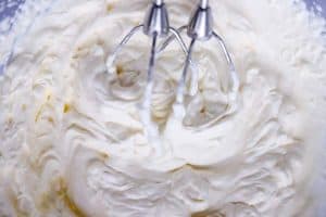 whipped cream with electric mixer beaters inside