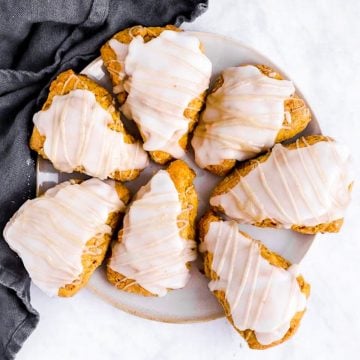 glazed pumpkin scones on white plate