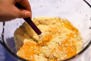 stirring pumpkin into flour mix