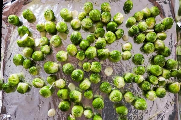 baking sheet with raw Brussels sprouts