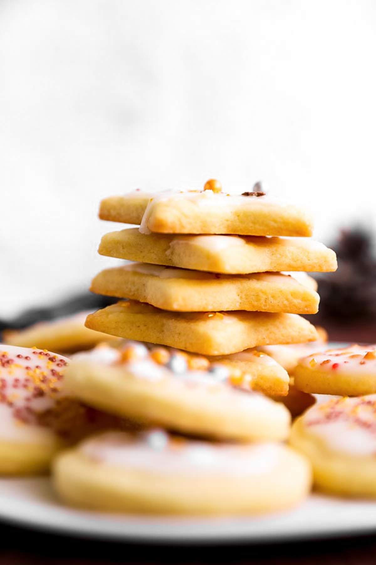 stack of sugar cookies on white plate