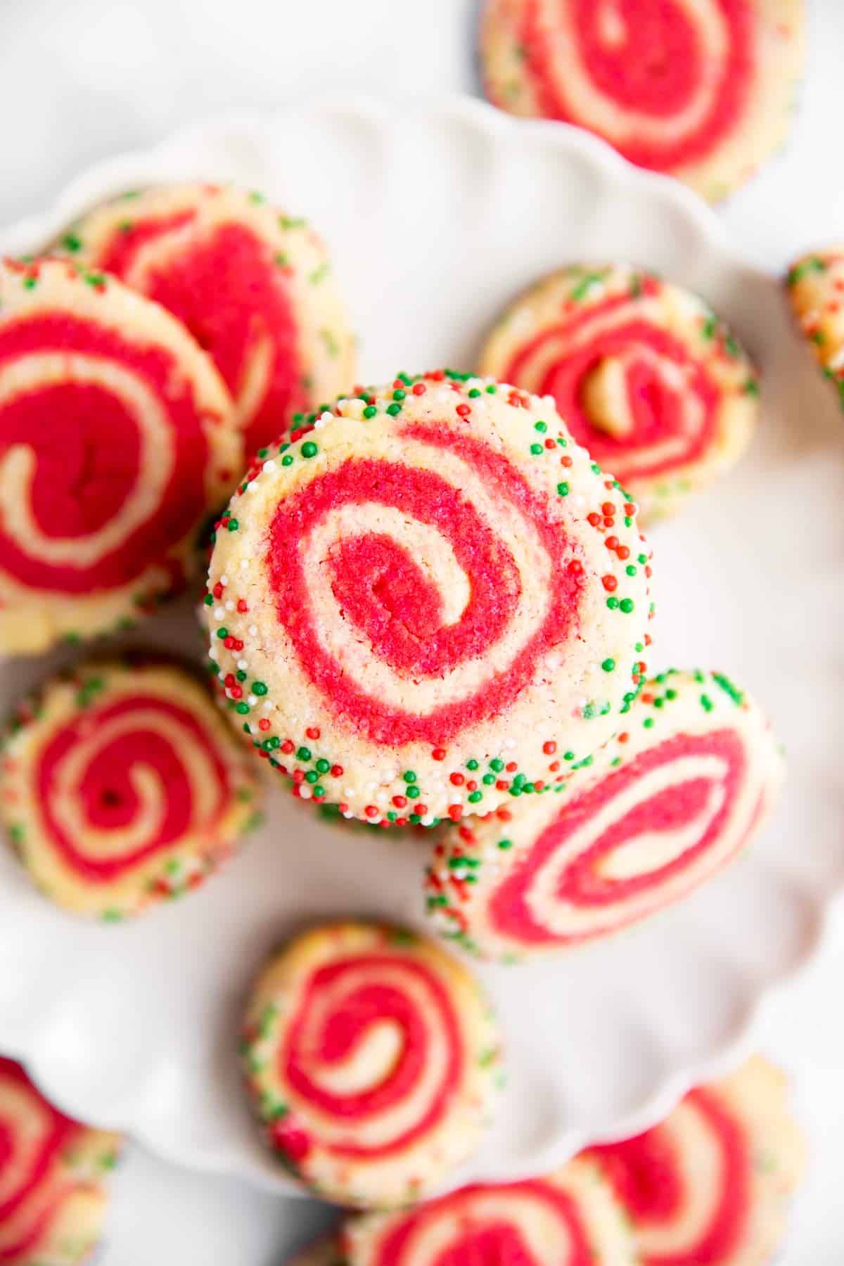 overhead view of Christmas Pinwheel Cookies on a white plate