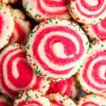 pile of pinwheel sugar cookies in holiday colors