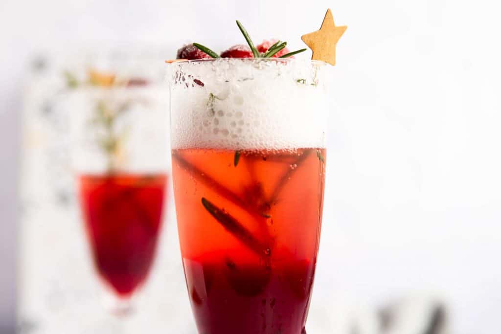 two decorated flutes with cranberry mimosa